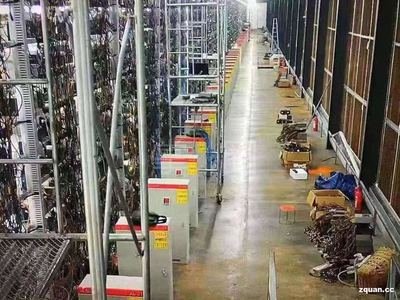 Cryptocurrency mining farm showcasing rows of high-performance mining rigs operating in optimized environments