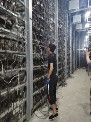 A modern mining farm with rows of servers generating cryptocurrency