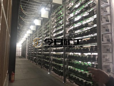 Inside view of a crypto mining farm with rows of miners connected
